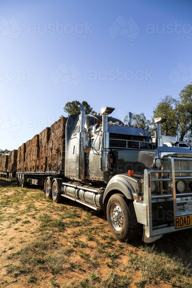 Large hay bales on semi-trailer heading to drought affected areas of QLD. - Australian Stock Image