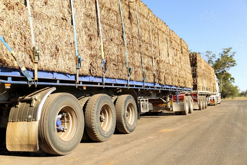 Large hay bales on semi-trailer heading to drought affected areas of QLD. - Australian Stock Image