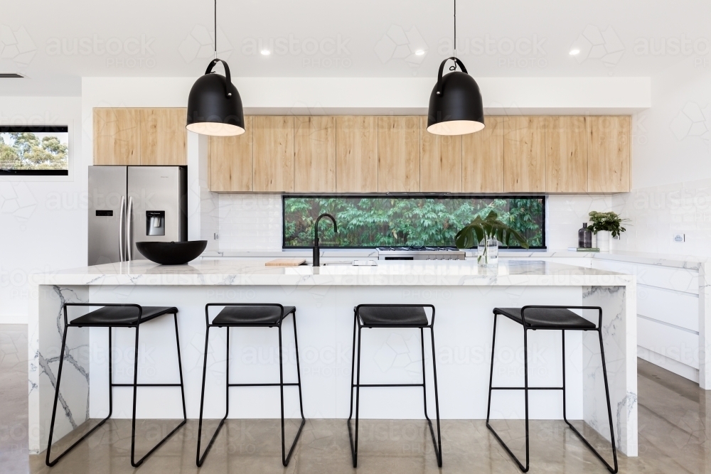 Large luxury Australian kitchen with marble island bench - Australian Stock Image