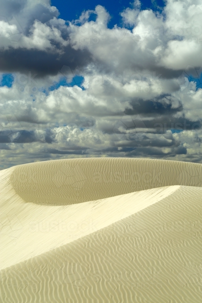 Large sand dunes and ripples under a summer sky - Australian Stock Image