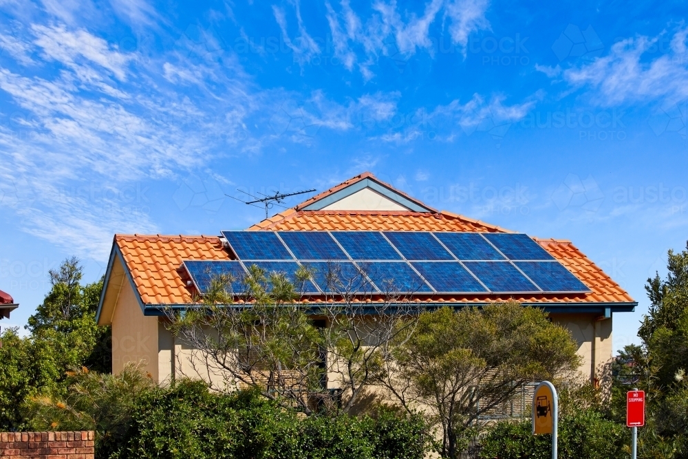 Large solar panels on suburban rooftop - Australian Stock Image