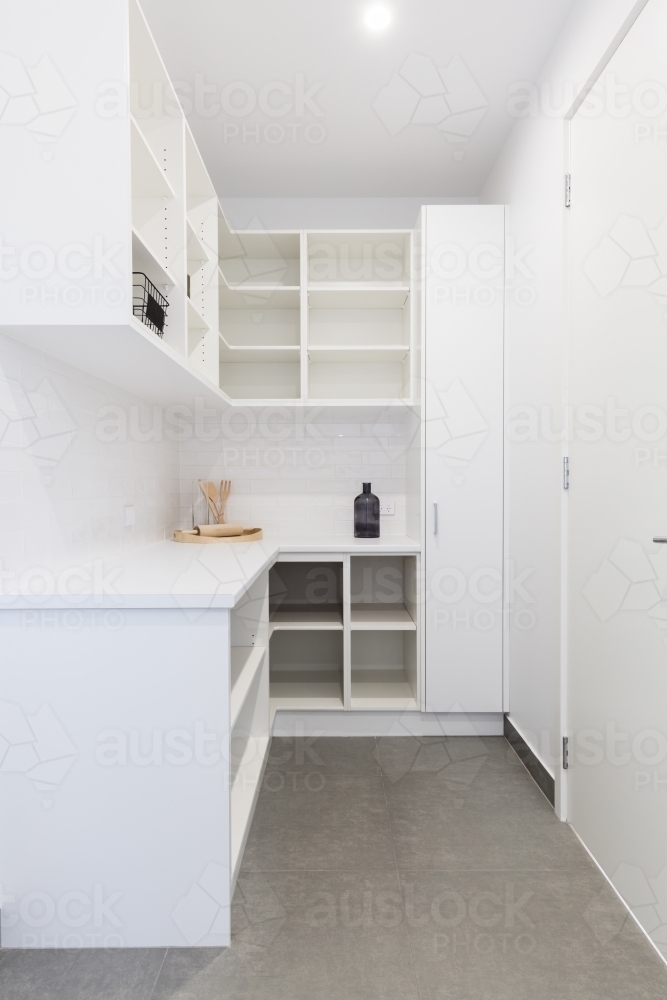 Large walk in butlers pantry storage area in a new home - Australian Stock Image