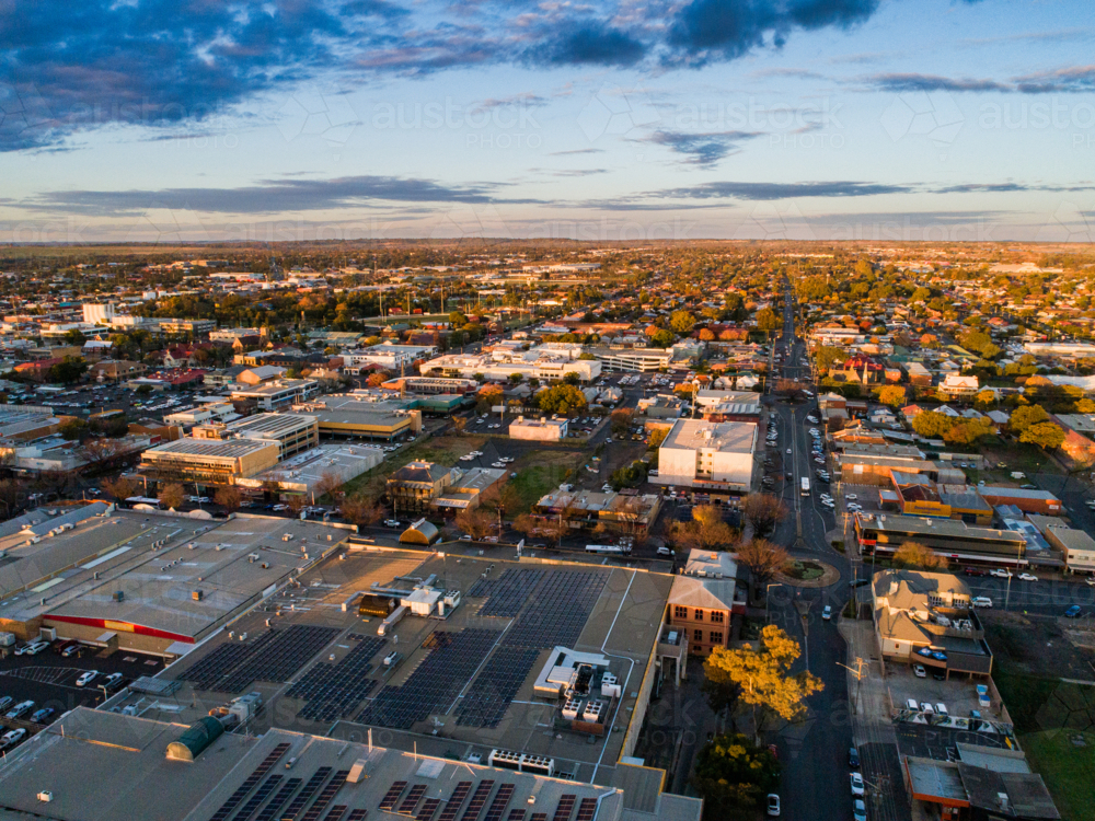 last light of the day over city streets of Dubbo in inland Australia from aerial view - Australian Stock Image