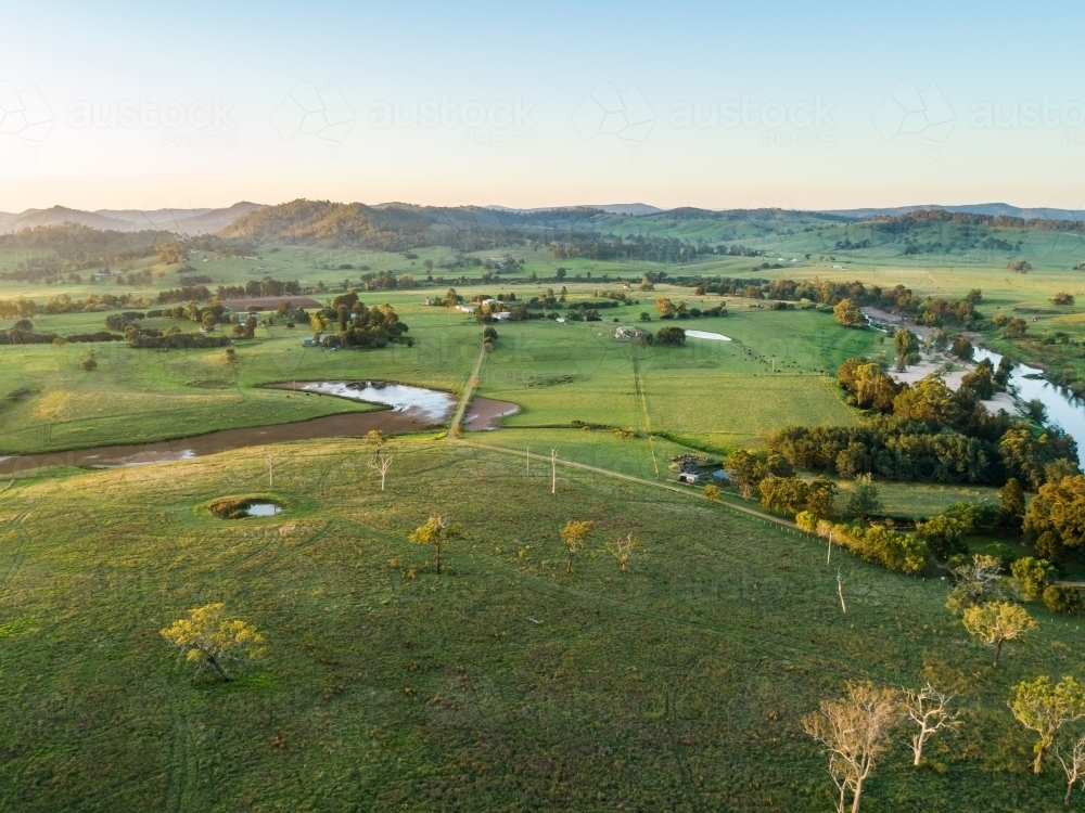 Last light of the day over farmland with dam beside Hunter River in Aberglasslyn Maitland - Australian Stock Image