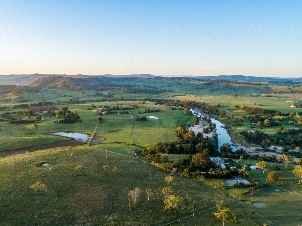 Last light of the day over farmland with dam beside Hunter River in Aberglasslyn Maitland - Australian Stock Image