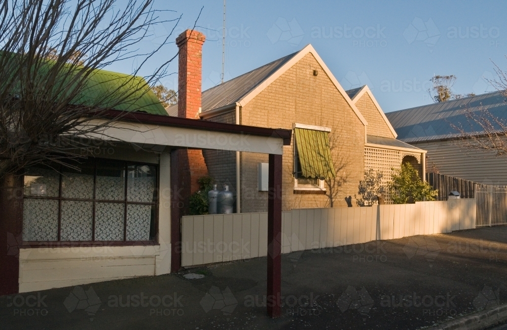 Last light on house in country town - Australian Stock Image