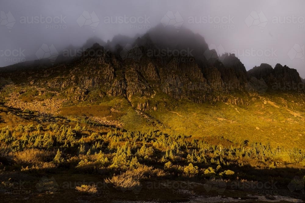 Late afternon sunlight on Cradle Mountain - Australian Stock Image
