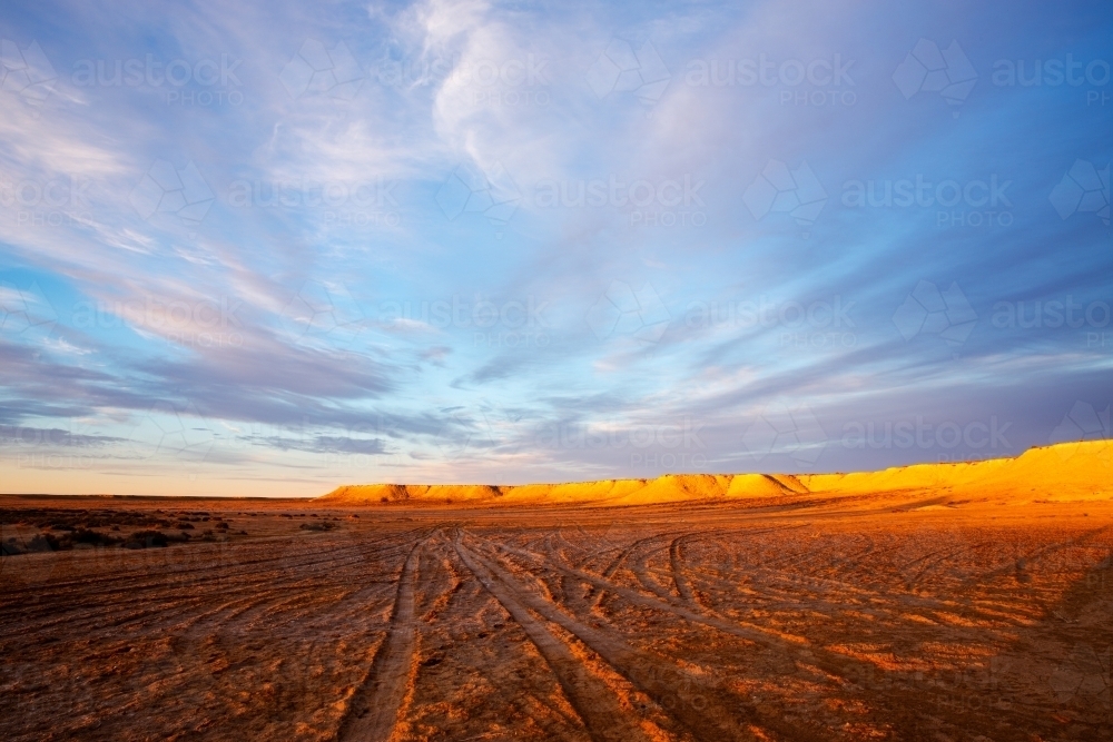 late afternoon light on banks of dry creek bed - Australian Stock Image