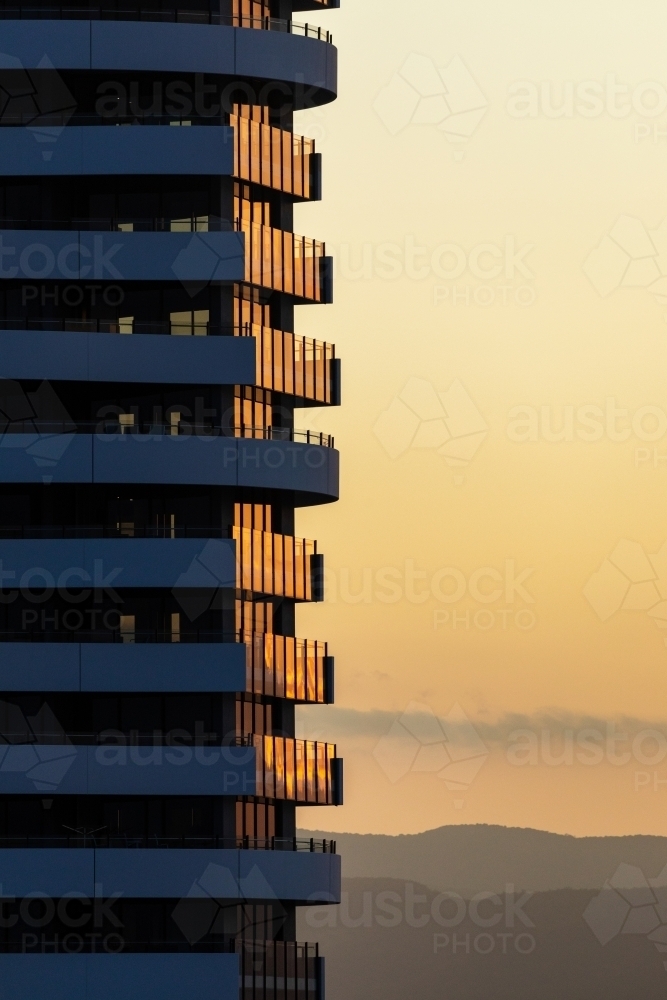 late afternoon light reflecting off high rise building - Australian Stock Image