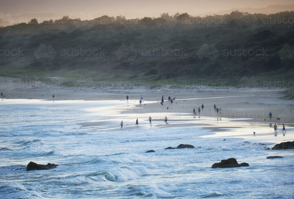 Late afternoon summer beach walking - Australian Stock Image
