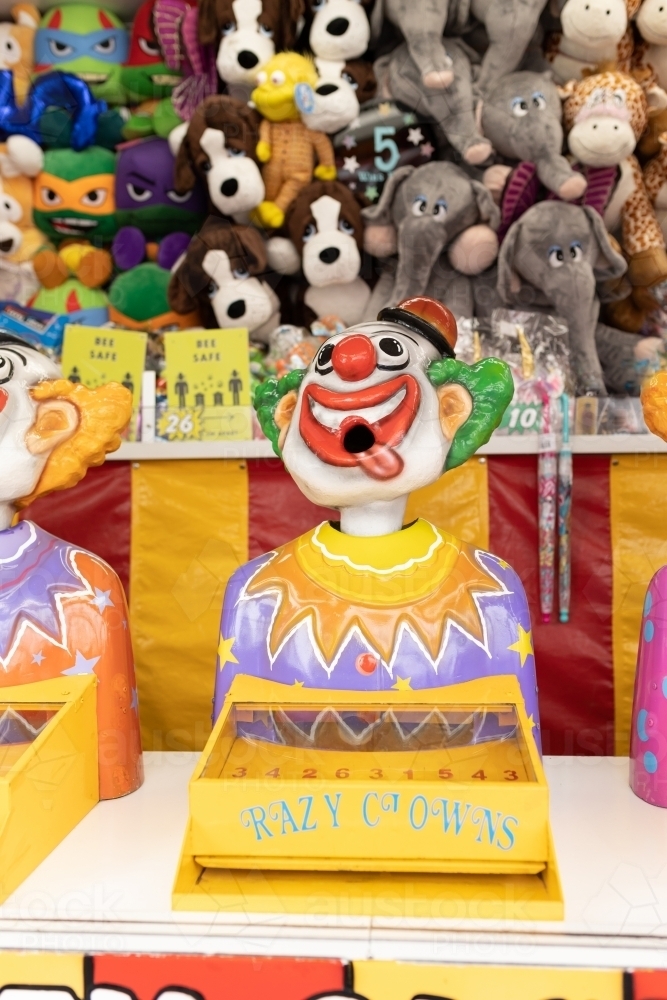 Laughing clowns game attraction at a fair carnival : Austockphoto Laughing clowns game attraction at a fair carnival - Australian Stock Image
