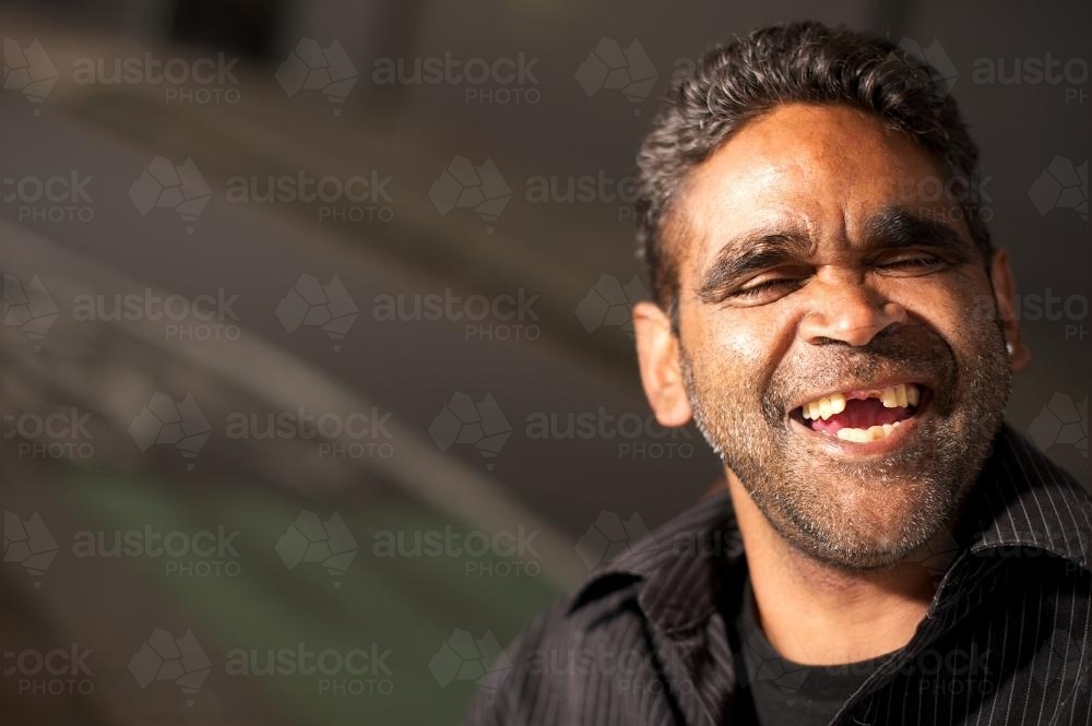 Laughing Indigenous Australian Man with Stubble - Australian Stock Image