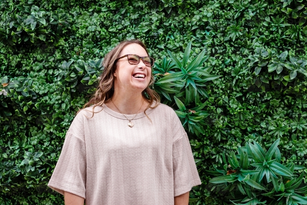 laughing woman, from a series featuring a young woman with Down Syndrome - Australian Stock Image