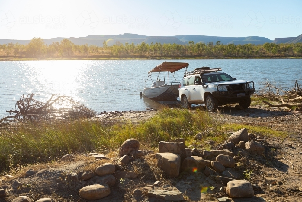 launching boat into river in the Kimberley - Australian Stock Image