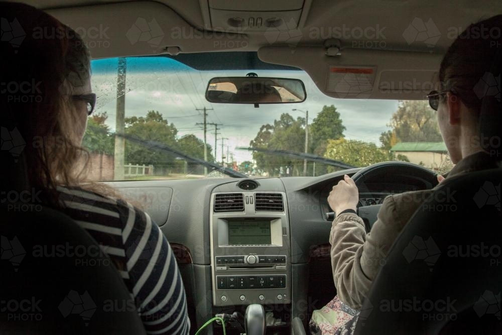 Learner driver getting rain driving experience - Australian Stock Image