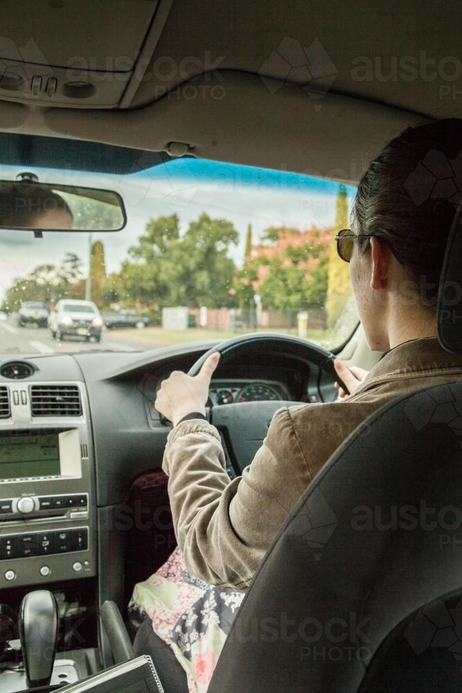 Learner driver getting rain driving experience - Australian Stock Image