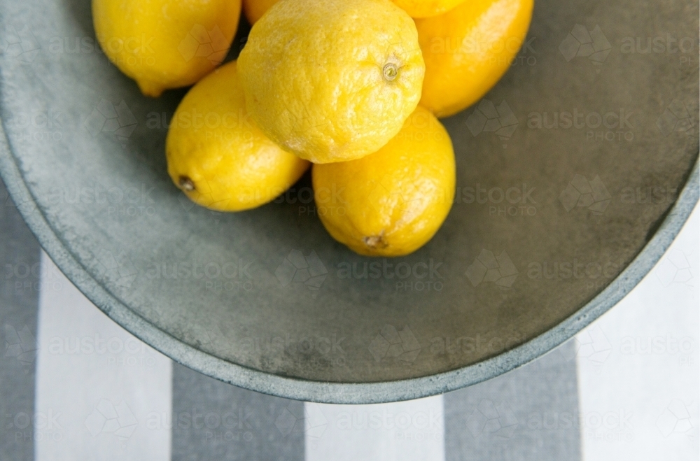 Lemons in a grey bowl - Australian Stock Image