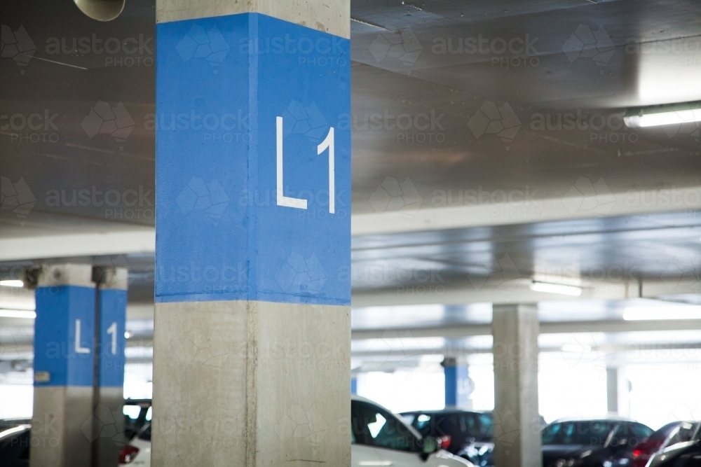 Level 1 sign in car parking area - Australian Stock Image