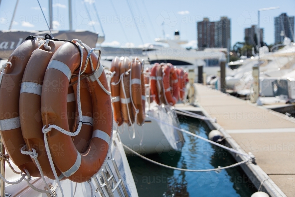 Life buoys on yachts at Rushcutters bay - Australian Stock Image