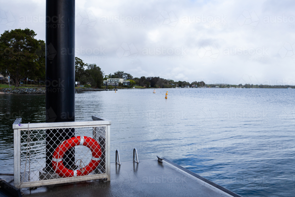 Life ring on pontoon on water of Hastings river in Port Macquarie - Australian Stock Image