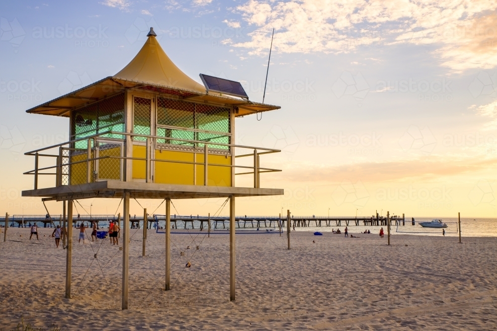 Life saver tower on beach at sunset - Australian Stock Image