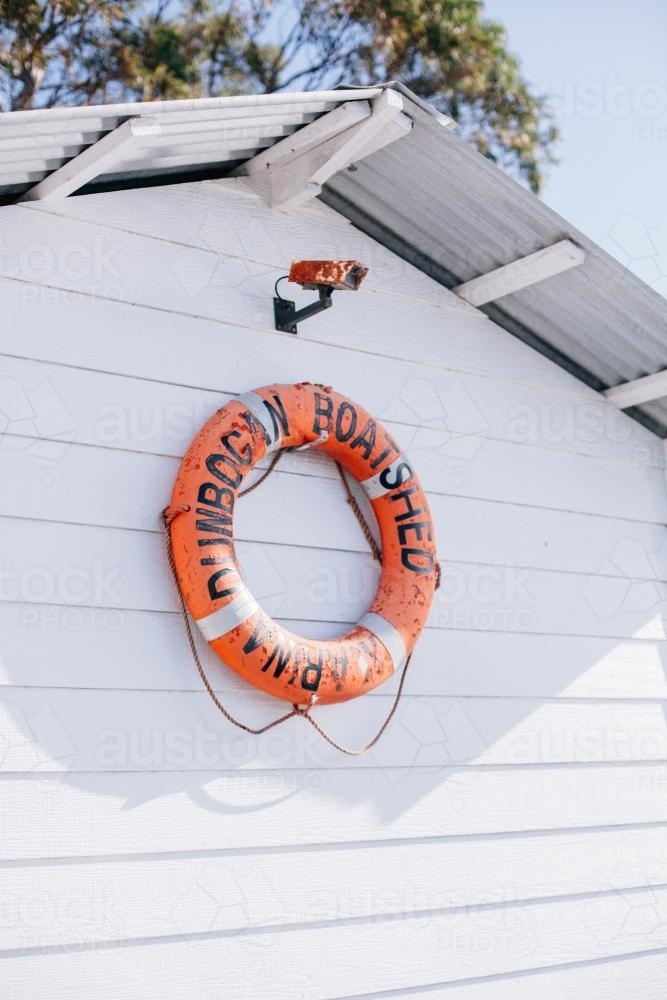 Lifebuoy hanging on a wharf shack - Australian Stock Image