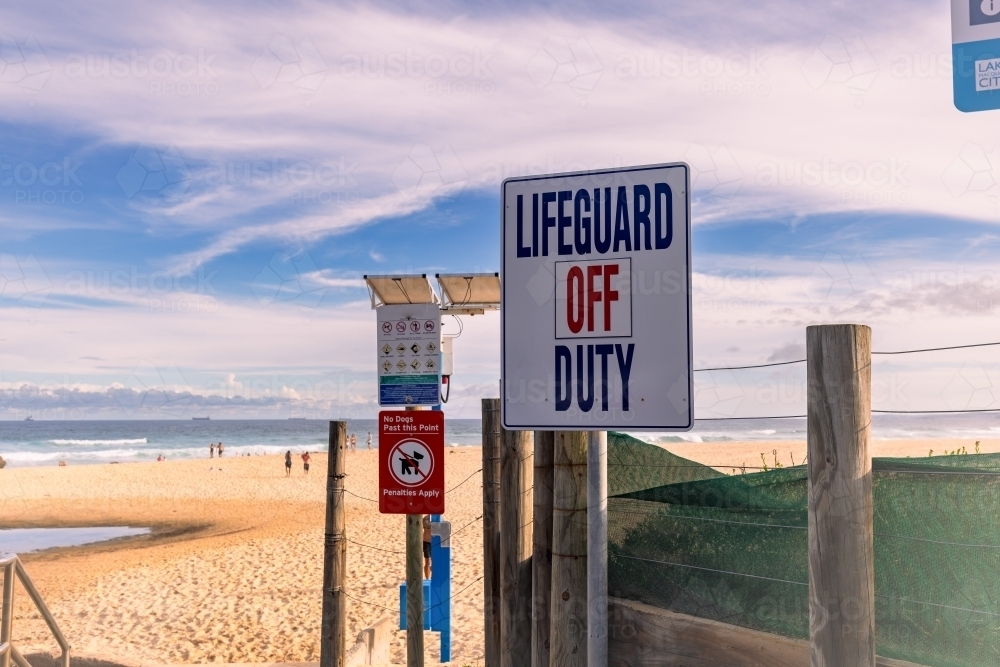 Image of Lifeguard off Duty sign at Redhead Beach NSW - Austockphoto