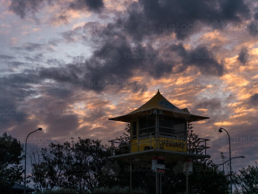 Lifeguard watch tower on the Gold Coast with sunset behind - Australian Stock Image