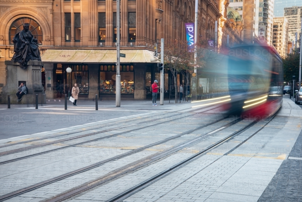 Light rail moving along track outside QVB in Sydney CBD - Australian Stock Image