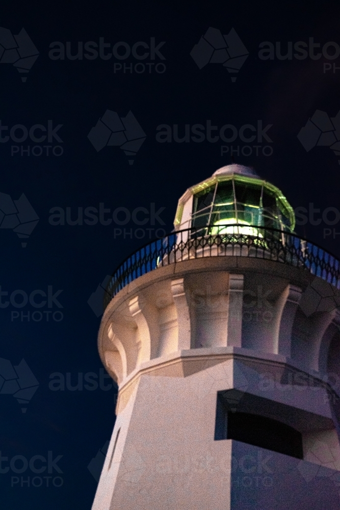 Lighthouse tower top with metal railings on a dark night sky - Australian Stock Image