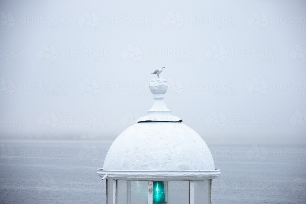 Lighthouse with metal railings in a mist - Australian Stock Image