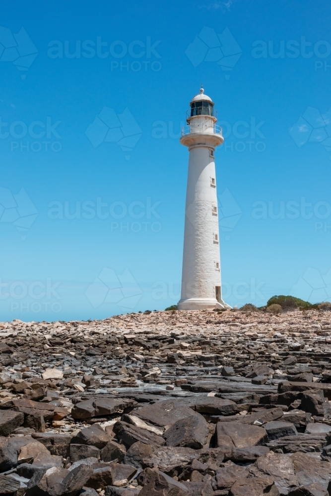 lighthouse with rocky foreground - Australian Stock Image