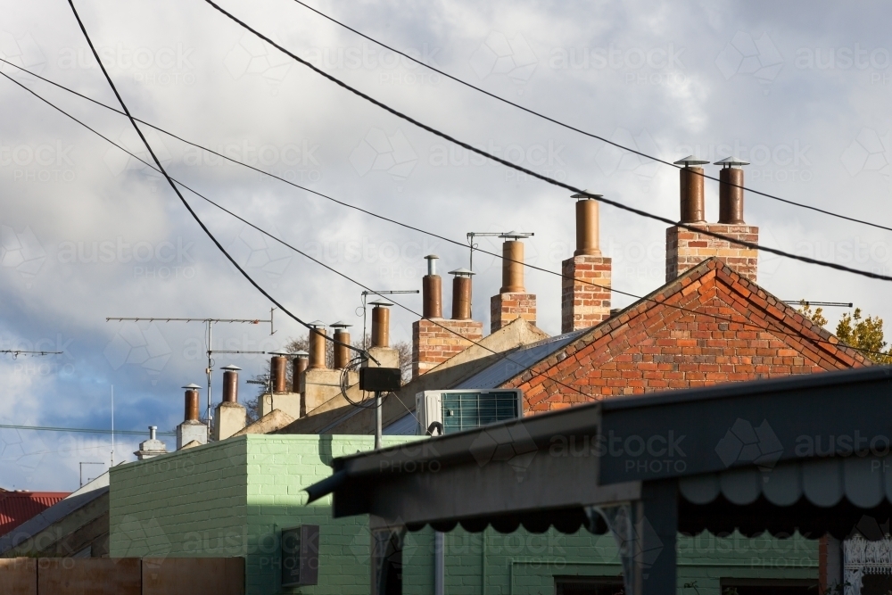 Line of chimneys on terrace houses - Australian Stock Image