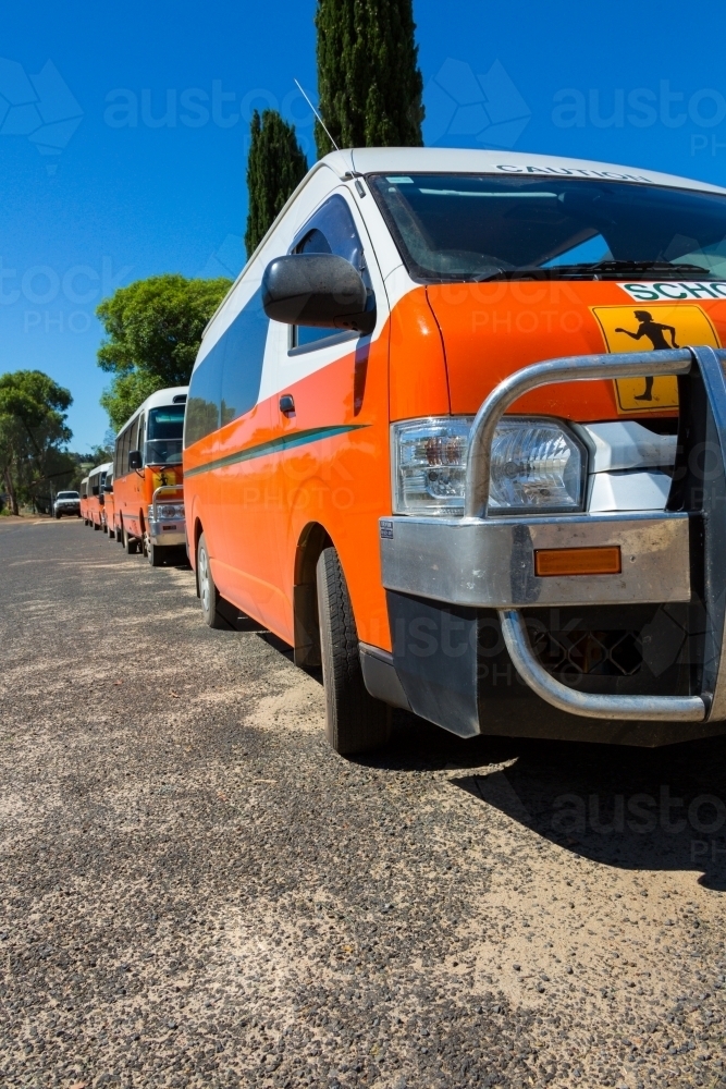 Image of Line of orange school buses - Austockphoto