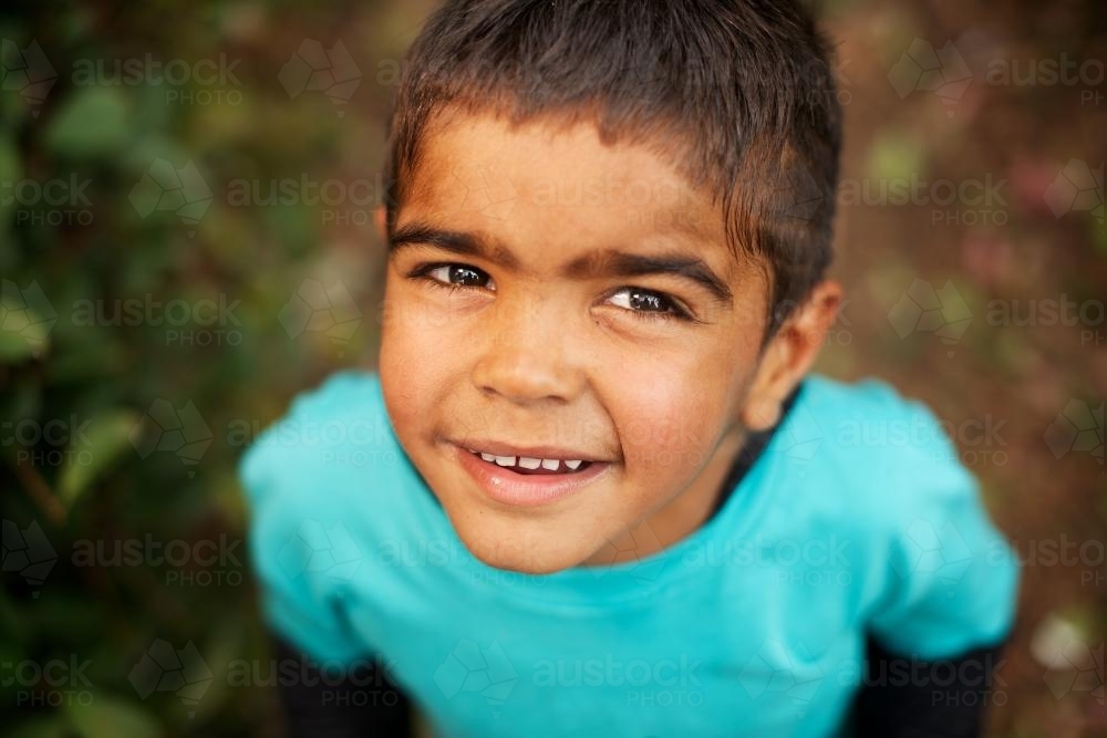 Little Aboriginal Boy Looking Upwards - Australian Stock Image