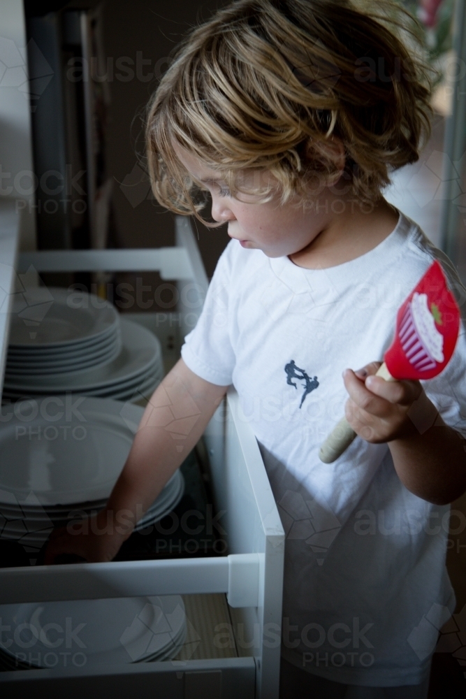 Little boy cooking - Australian Stock Image
