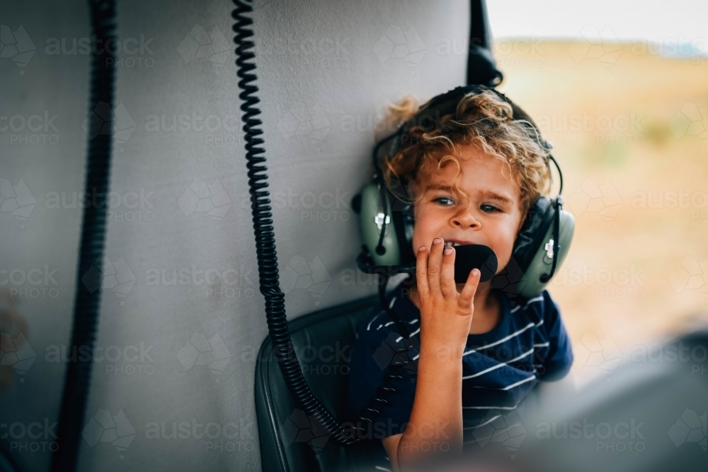 Little boy on a helicopter - Australian Stock Image