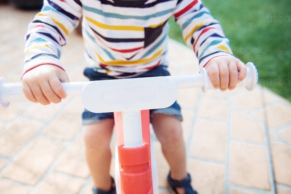 Little Boys Hands on Balance Bike - Australian Stock Image