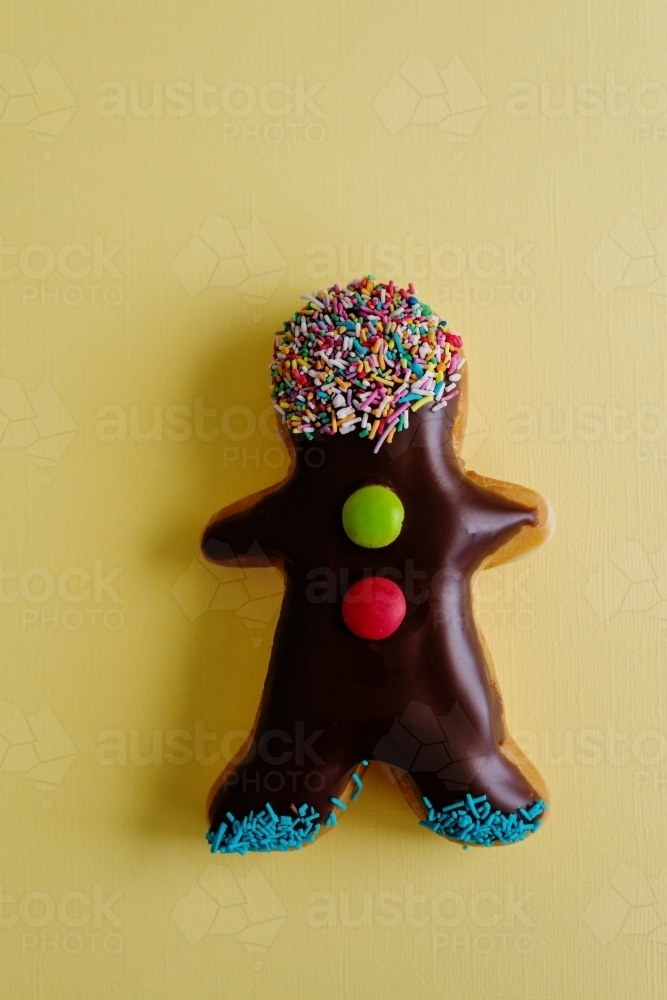 little donut man on yellow - Australian Stock Image