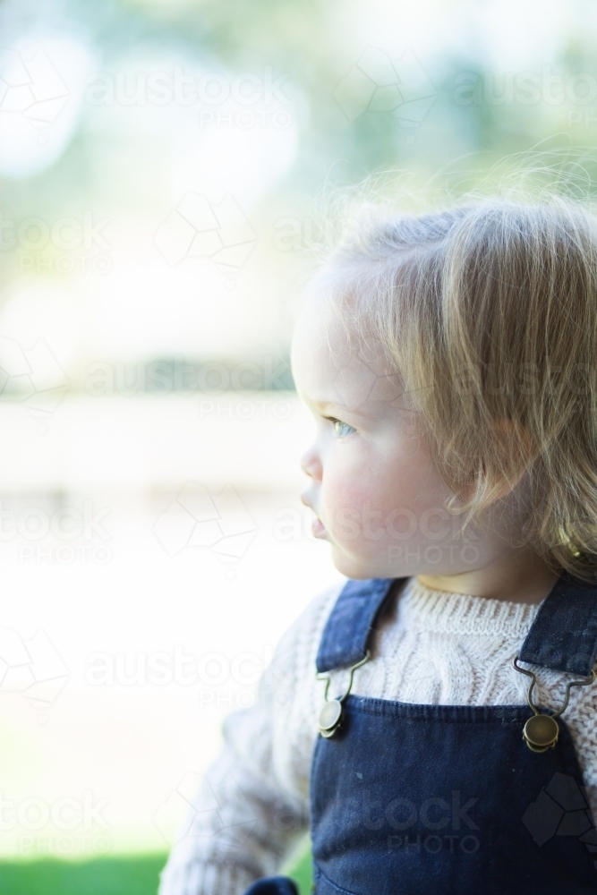 Little girl looking to the side with copy space - Australian Stock Image