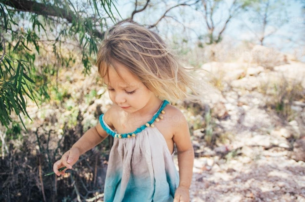 Little girl playing in the bush - Australian Stock Image