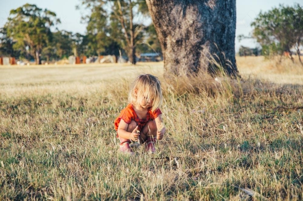 Little girl playing outside - Australian Stock Image