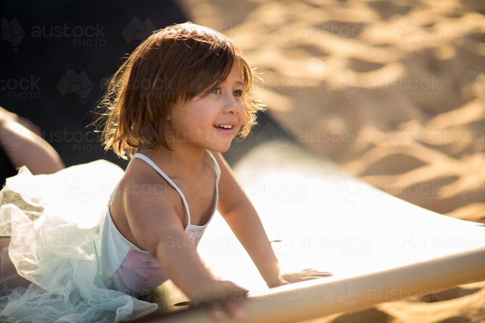 Little girl playing outside in the sunshine - Australian Stock Image
