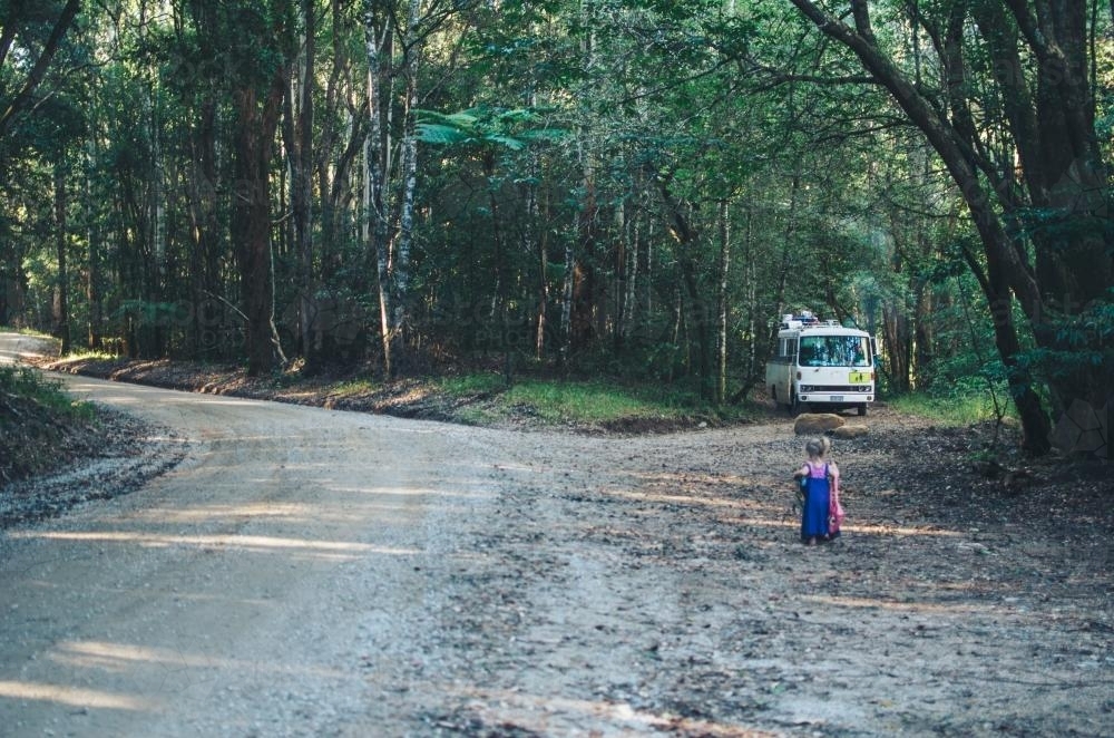 Little girl walking to bus - Australian Stock Image