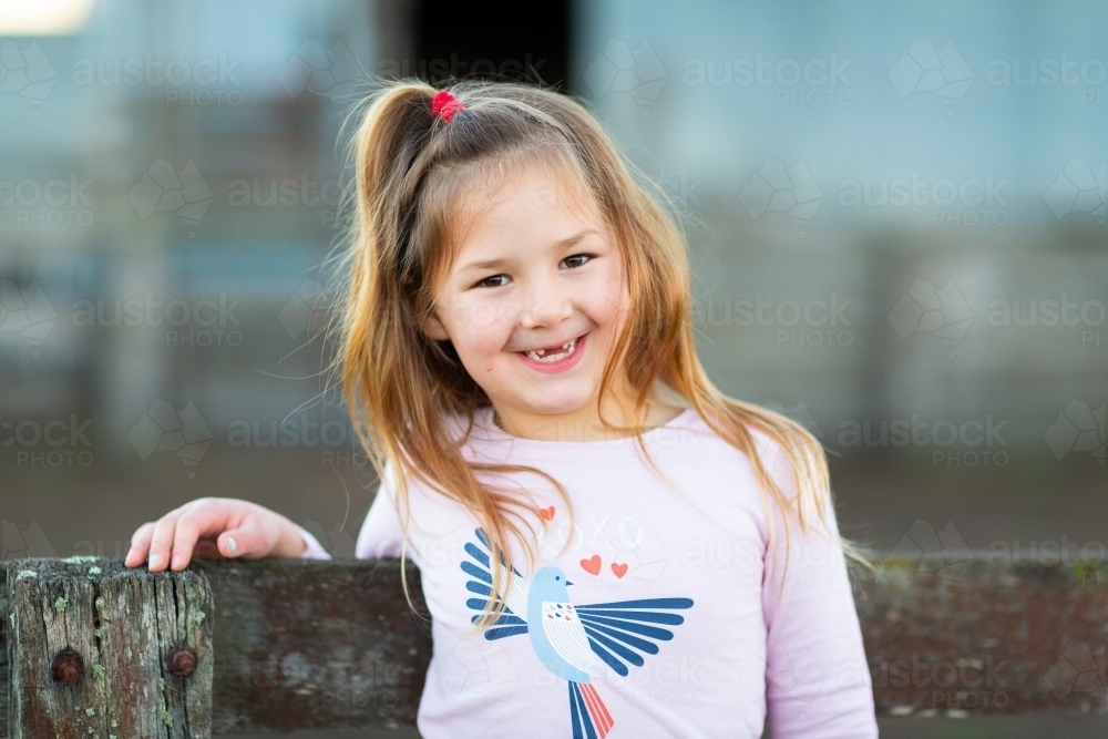 Little girl with long hair and no front teeth - Australian Stock Image