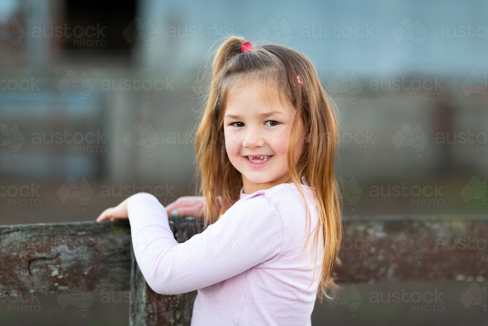 Little girl with long hair and no front teeth - Australian Stock Image