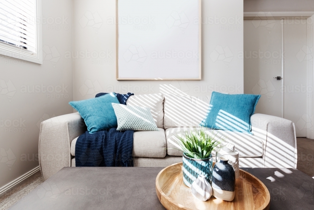 Living room sofa with blank picture mock up for your artwork - Australian Stock Image
