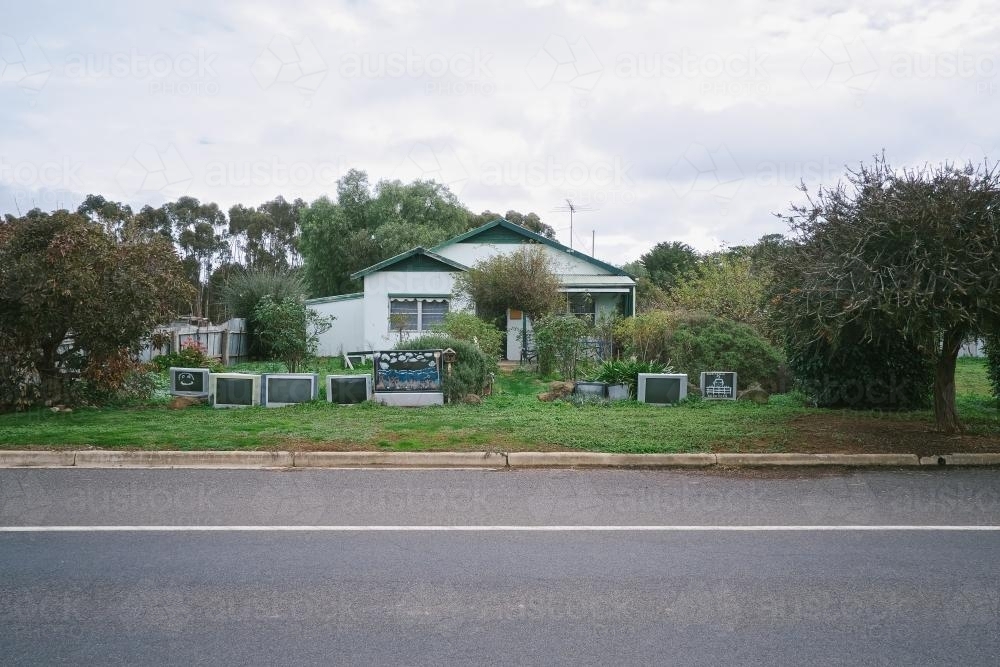 Local house in country town with a TV fence - Australian Stock Image