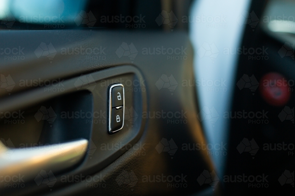 Lock and unlock button on open car door - Australian Stock Image