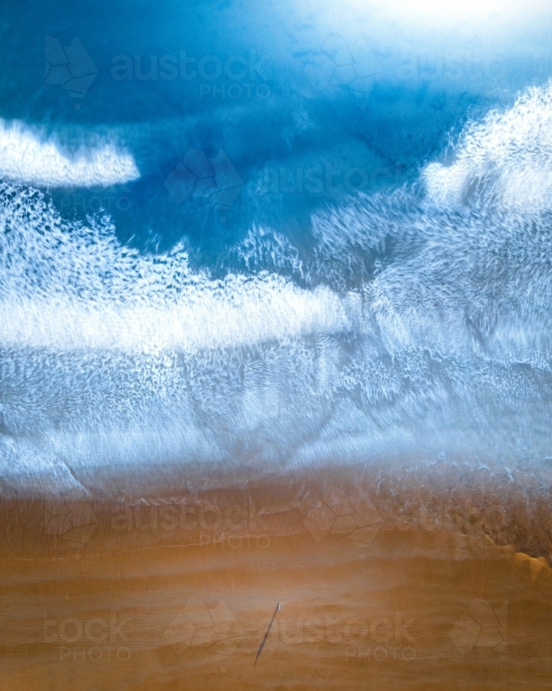 Lone figure stranded on a beach - Australian Stock Image